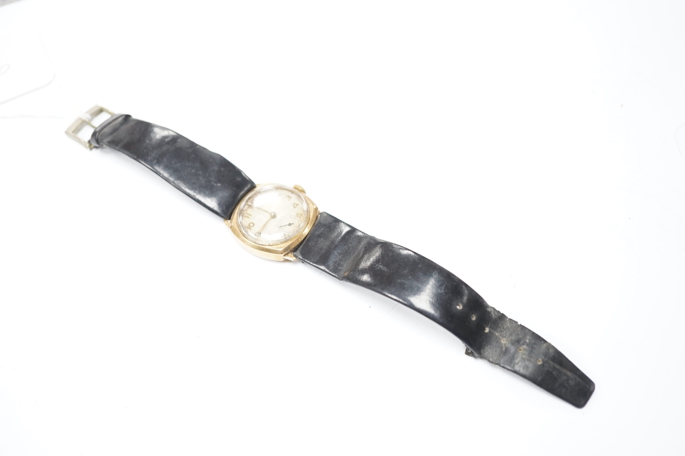 A gentleman's early to mid 20th century 9ct gold manual wind wrist watch, with subsidiary seconds, on a leather strap.